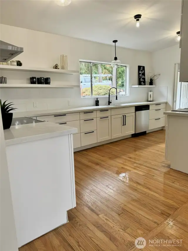 KITCHEN VIEW OFF DINING AND FAMILY ROOMS