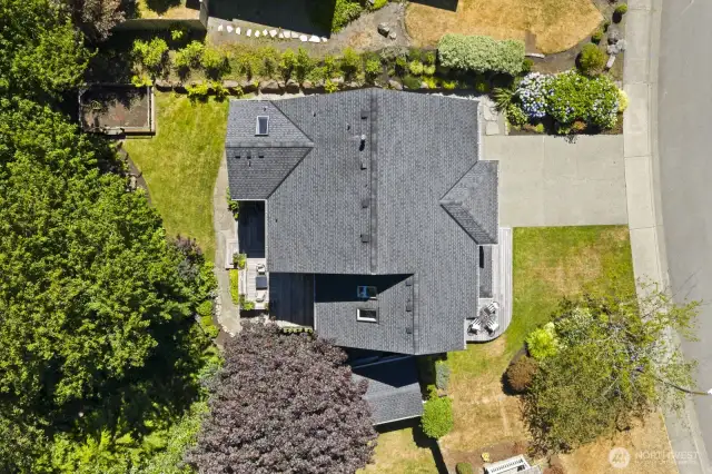 On this quarter acre lot, with mature landscaping and a babbling creek, there is plenty of space for all your outdoor activities.