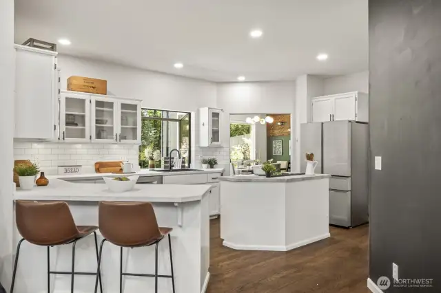 The bar top that opens up to the living room from the kitchen is a fantastic spot to enjoy a quick meal or hang out.