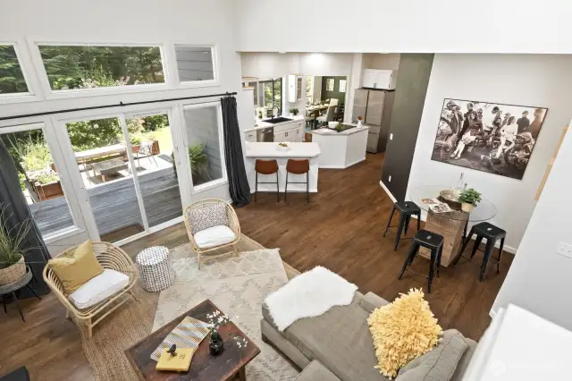 From the stairs you can get a complete view of the main living spaces thanks to the vaulted ceilings and open layout.