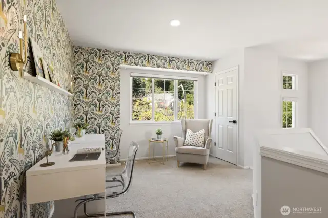 The fun loft area includes a large window, storage closet and nook space-- perfect for a quiet spot to read, relax or get work done.