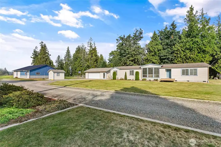 Welcome home! Well maintained over 2,000 sq ft home on shy 10 acres w/det garage, spacious shop & tons of pastureland!