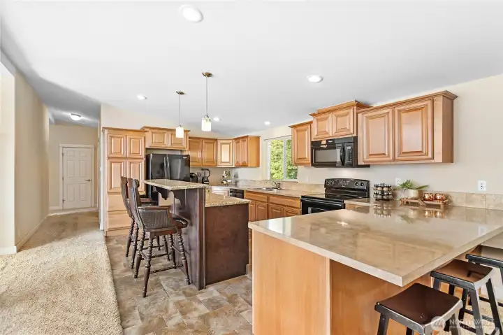 Tons of cabinet & counter space in this open kitchen