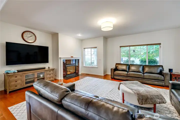 Natural light does most of the heavy lifting here. A cozy gas fireplace anchors the room, making it a reliable spot for rainy PNW afternoons.