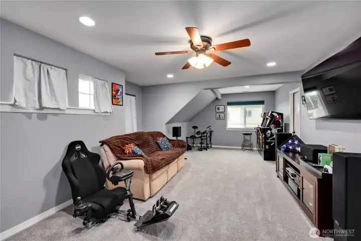 Game room above the garage with large storage closet