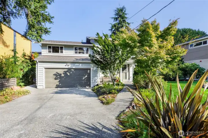 South facing home w/ oversized driveway & easy-stroll entry sidewalk