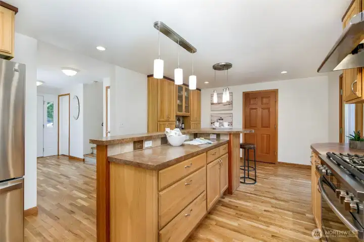 Unique 2-tier island makes cooking & entertaining simple. Enjoy these beautiful hardwood floors in almost all rooms in home.
