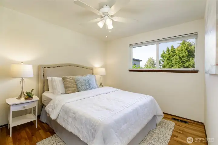 Guest bedroom w/ backyard views
