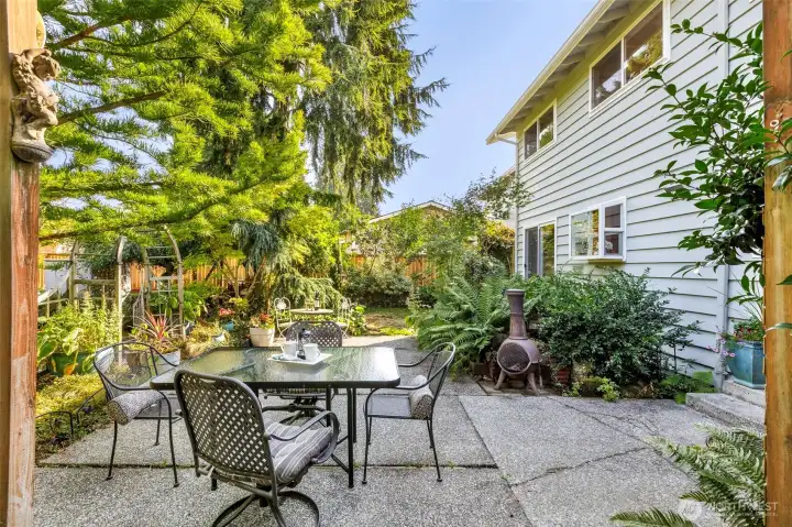 Step back out to this private & sunny backyard