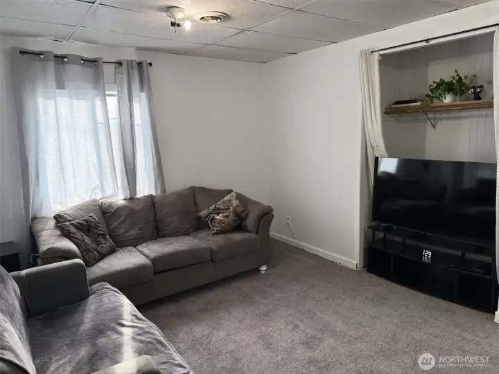large living room with inset for TV or closet space