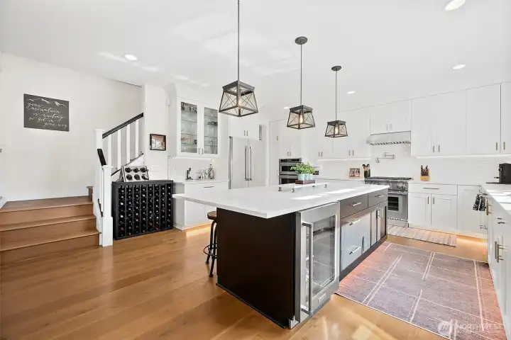 Wine or beverage fridge. Coffee or cocktail bar. Storage on BOTH sides of this enormous island.