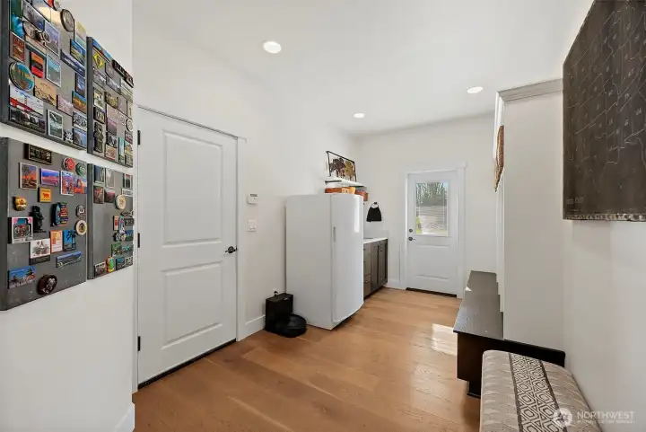 Mud room for all your things when you are coming in from either the garage or the backyard.  Just outside the door to the yard is an outdoor shower so the outside actually stays outside! Easy to come and go to the new hot tub!