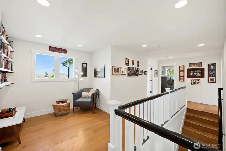 Up the stairs to bedrooms, laundry and this sweet book nook area!