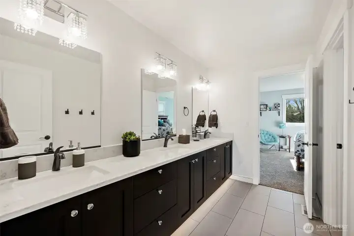 Jack and Jill bath. 3 sinks yes! it's not a trick of the camera. So much room and storage in this space.