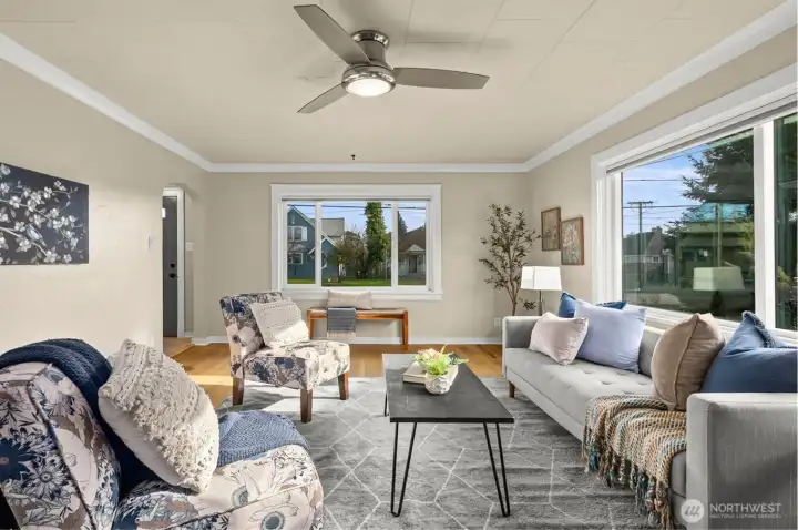 Sunlight steals the show here. All newer vinyl windows fill the space with natural light, while warm neutral walls and classic white trim create a calm, inviting canvas that makes the room feel instantly welcoming and easy to imagine living in.