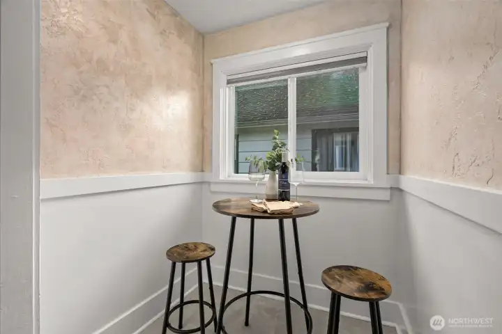 The breakfast nook feels like a little Old World hideaway, with plaster-style walls that add so much texture and warmth. Cozy and inviting, it’s easy to imagine this as a favorite spot for morning coffee, a creative corner, or a relaxed work-from-home nook you’ll keep coming back to.