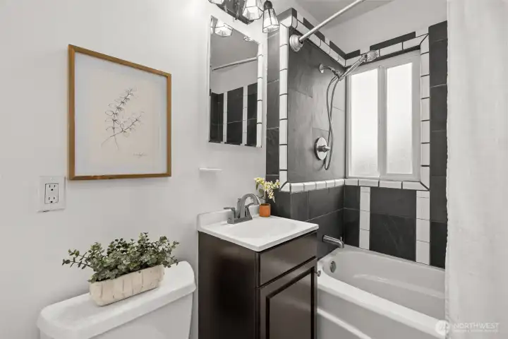 Clean, classic, and absolutely stunning. The black and white tiled shower surround feels timeless and fresh, a beautiful finishing touch that elevates the entire space.