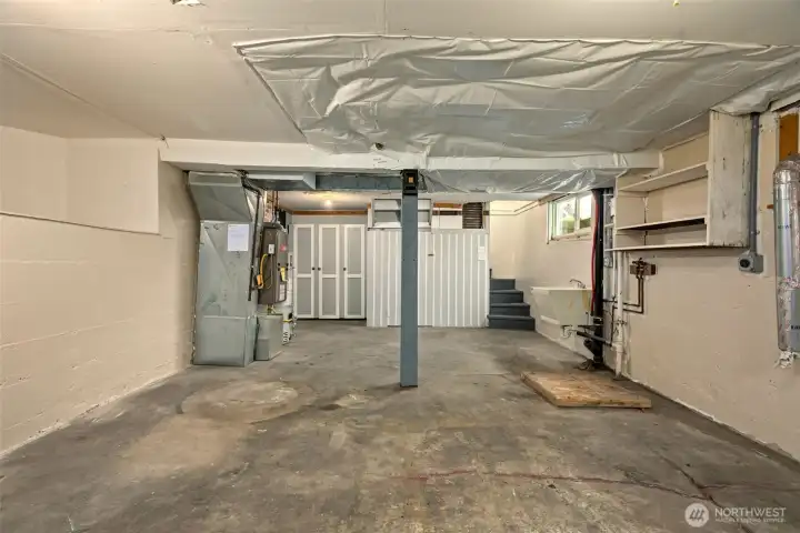 Of course the washer and dryer hookups are down here too. It’s a clean, well-lit space that feels practical and easy, making laundry and storage feel refreshingly straightforward.