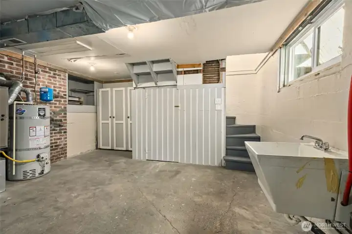 An unexpected bonus down here, a newer utility sink paired with impressive built-in storage makes this space feel extra functional and thoughtfully set up.