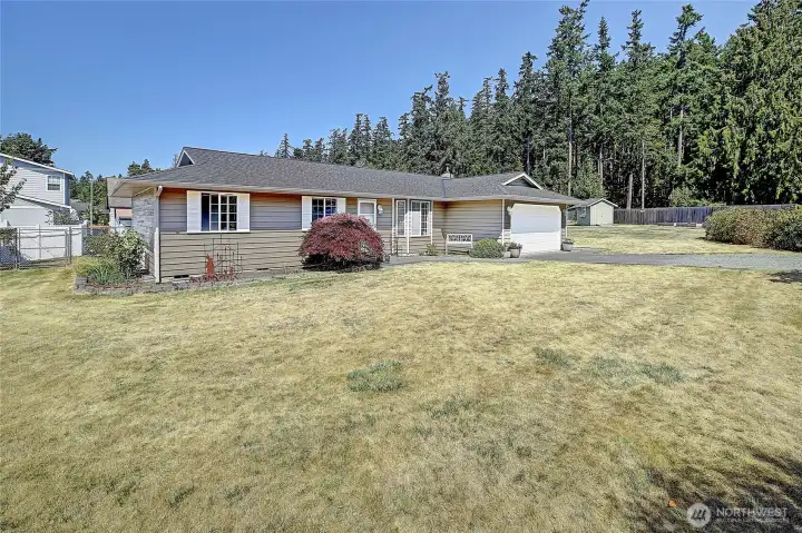 Well maintained home with double lot--the yard with the shed is all part of this property.