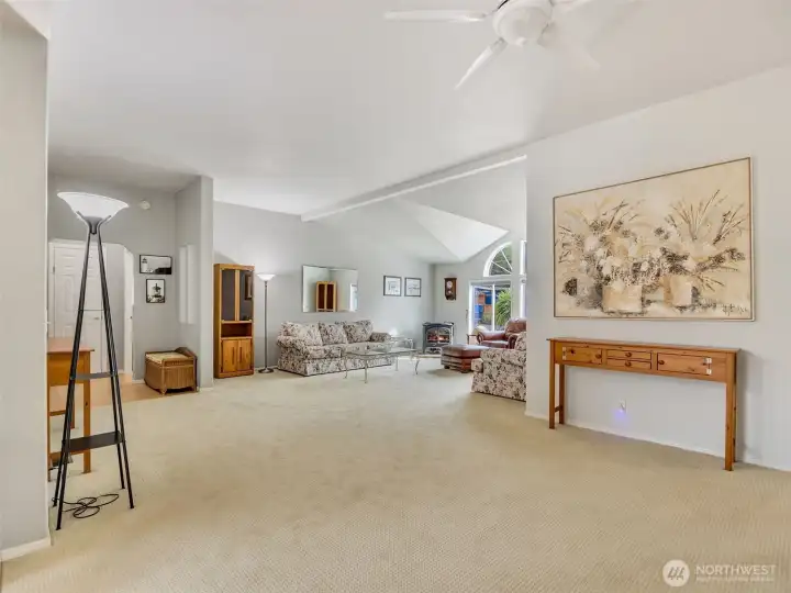 This great room connects the living areas and tall ceilings make it feel light and bright inside.