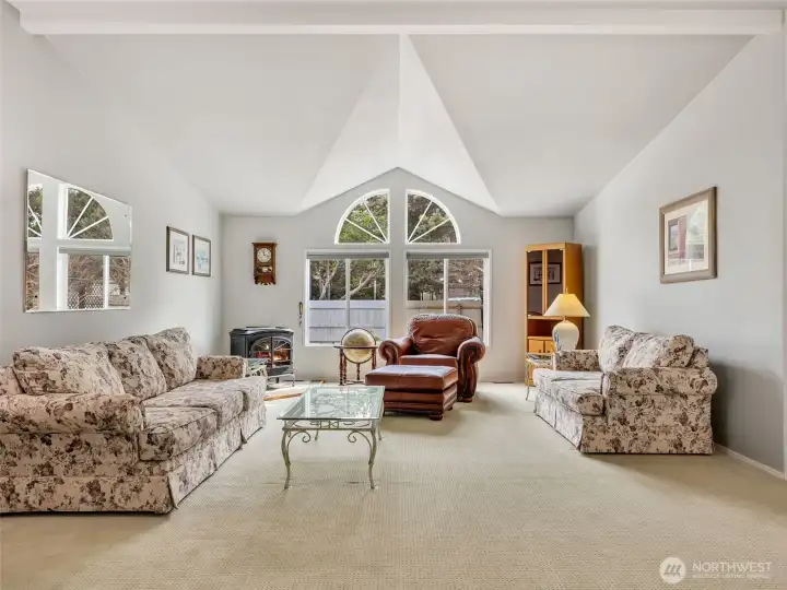 This great room connects the living areas and tall ceilings make it feel light and bright inside.