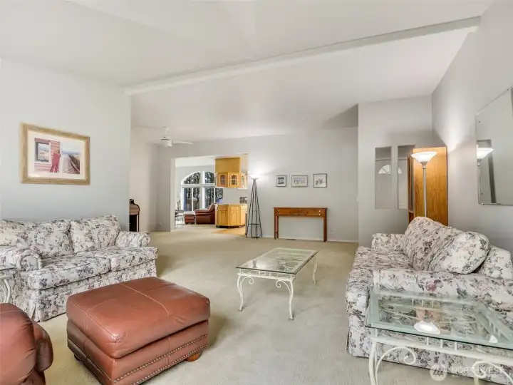 This great room connects the living areas and tall ceilings make it feel light and bright inside.