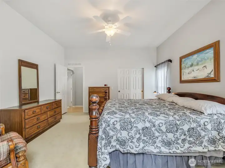 Primary bedroom with closet and attached full bathroom.