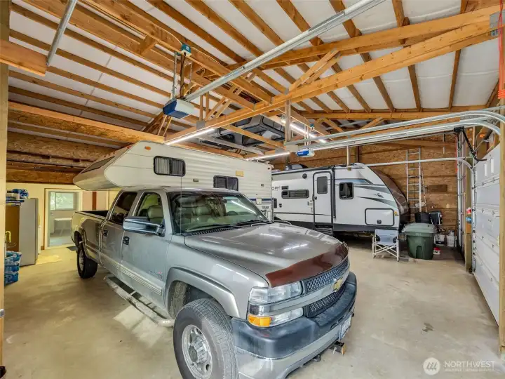Large detached garage and shop with RV storage.