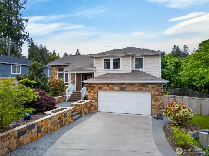 Beautifully maintained home with striking stone accents, mature landscaping, and a private cul-de-sac setting in the heart of Mount Vernon.