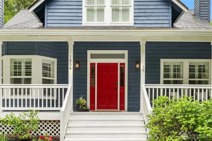 Charm abounds with the classic covered front porch and sharp paint colors. Charm abounds with the classic covered front porch and sharp paint colors.