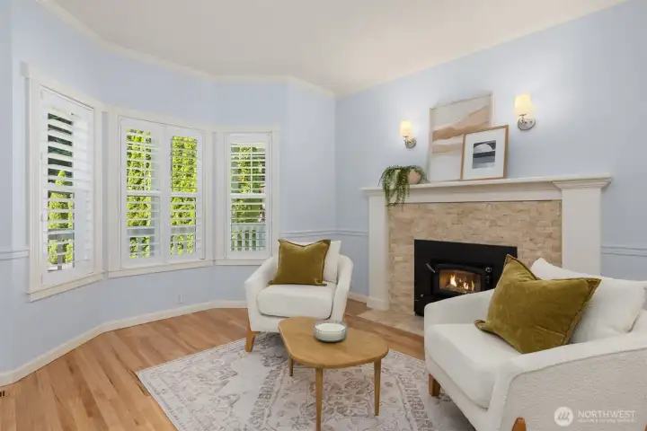 The cozy formal living room with wood stove is just off the entryway. The cozy formal living room with wood stove is just off the entryway.