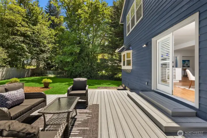Step out from the living spaces to your new Trex deck and large backyard. Great flow for entertaining and day to day living. Step out from the living spaces to your new Trex deck and large backyard. Great flow for entertaining and day to day living.