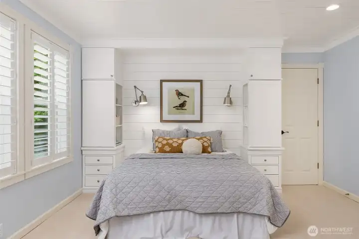 Detail of the custom shiplap wall and built-ins in the primary bedroom. Detail of the custom shiplap wall and built-ins in the primary bedroom.