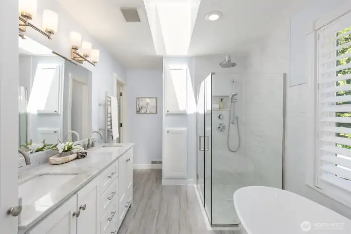 The primary bathroom has been completely remodeled with an oversized shower, soaking tub, marble countertop with dual sinks, towel warmer and modern tiles and fixtures. The primary bathroom has been completely remodeled with an oversized shower, soaking tub, marble countertop with dual sinks, towel warmer and modern tiles and fixtures.