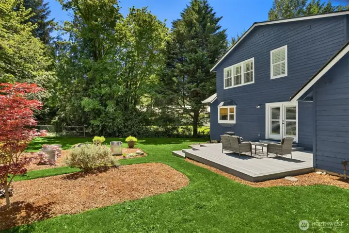 View of the large back yard and lawn - looks like an excellent place to play. View of the large back yard and lawn - looks like an excellent place to play.