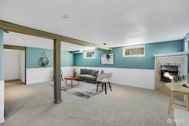 Corner fireplace adds a nice warm touch to this family room.