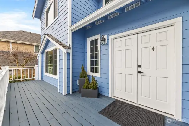 Large front deck with double door entry