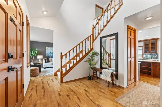 Vaulted foyer with open staircase