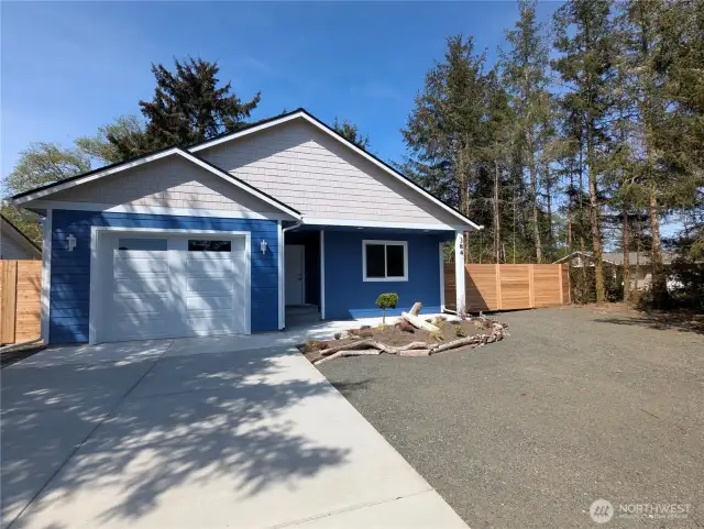 Large, level, fully fenced corner lot with mature trees