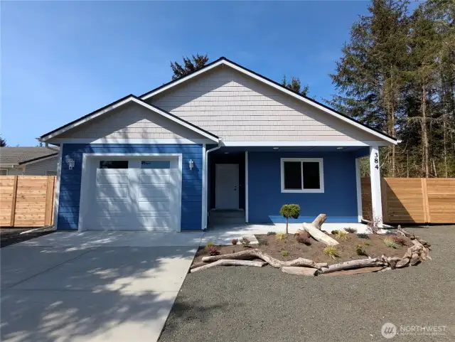 Beachy landscaping and mature trees