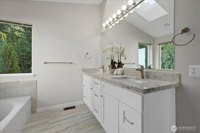 New Master bathroom vanity cabinets with new floors, master shower, and toilet.