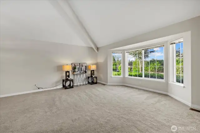 Vaulted ceilings & large windows fill the space w/natural light in living area.