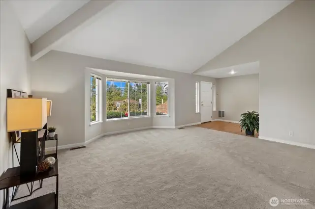 Vaulted ceilings & large windows fill the space w/natural light in living area.