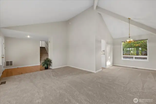 Vaulted ceilings & large windows fill the space w/natural light in living & dining area.