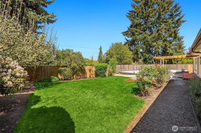 The huge backyard is totally level and offers complete privacy.