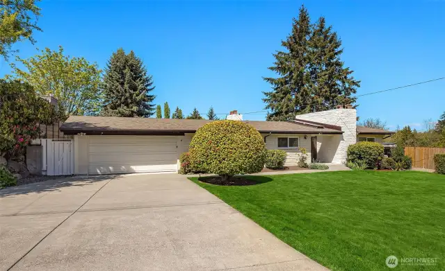 An extra wide driveway offers tons of parking options.