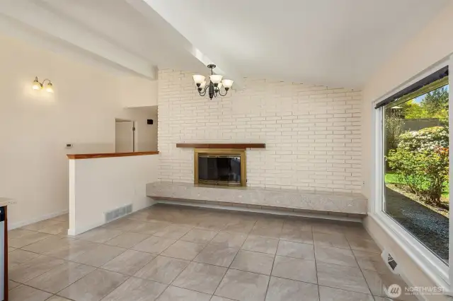 A wood-burning fireplace graces the family room.