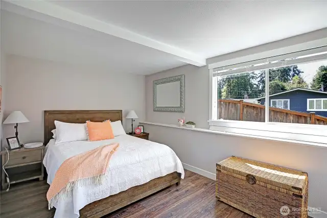 Lower level primary bedroom with slider to the lower deck