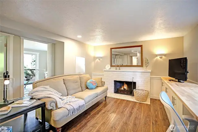 Lower level rec room with fireplace